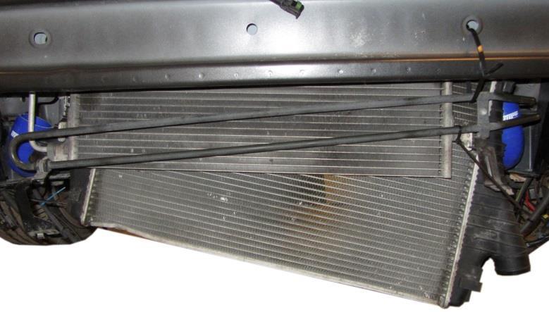 Remove the intercooler by lifting it up from the radiator slots and then