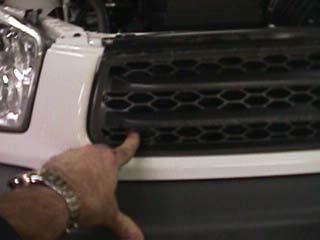 Remove the front grille, starting with two large Phillips screws on the top (Fig.D) on each side and three additional smaller screws across the middle.