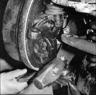 Page 6 of 9 7. Be sure to secure the spring with a safety chain when you prepare to remove the drum brake assembly.