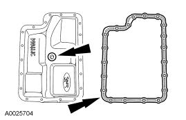 13. NOTE: Do not discard the gasket unless damaged. This is a reusable gasket. NOTE: Apply a light coat of petroleum jelly to hold the gasket to the fluid pan.