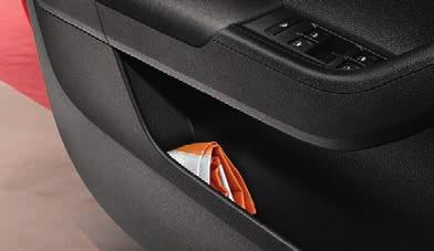35 34 BOTTLE HOLDERS The storage compartments in both rear doors can