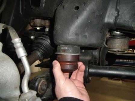 Remove the 4 control arm bump stops from the frame. You may need to smack them with a dead blow hammer to dislodge them. Be careful of the rebound.