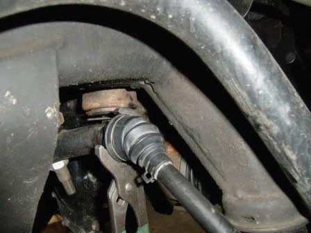 Strike the tie rod boss with a dead blow hammer to dislodge the taper.