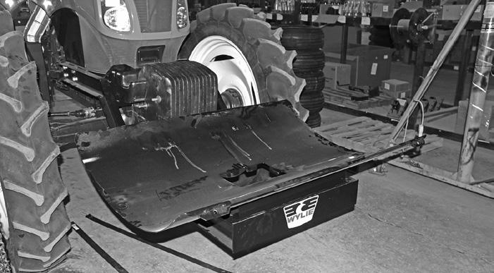 < Tank Saddle Tractor Weights > < Frame Lock Bolt > < Weight Lock Bracket Figure C44 Tank Saddle Installed Set the tank