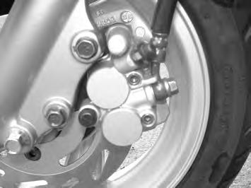 FRONT BRAKE: PLEASE OPEN THE COVER OF THE VIEWING HOLE AND ACTING THE BRAKE FOR CHECKING. IF THE INDICATOR ALMOST REACHES THE DISK, PLEASE ASK YOUR DEALERS TO CHANGE IT.
