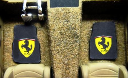 Search the internet for car floor mats; use the pictures of the flat mat display and save it.