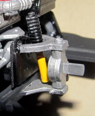 Snap the spindles into the lower A-arm on the chassis without glue (tie rod forward).