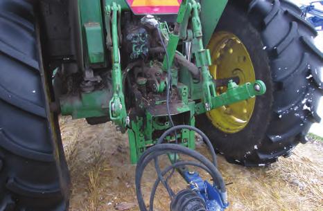 7. Connect the wiring harness to the tractor to provide power to the machine. Be sure to secure to the hitch and provide sufficient slack for turning. FIG.