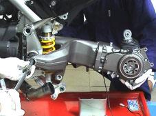 Fit the ring nut on the swingarm shaft and tighten finger tight.