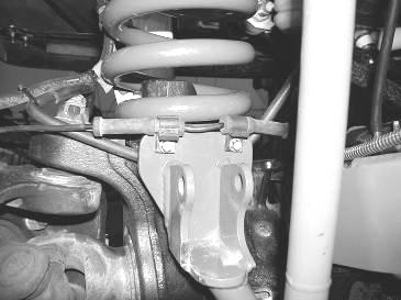 Picture shows coils already installed for proper ABS placement Driver side shown above 15. Locate FT30442 Billet sway bar end links.
