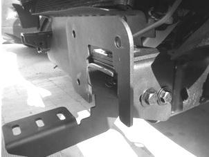 Secure the frame bracket and auxiliary bracket to the sides of the frame using (4) ½ x 1 ½ hex bolts, (8) ½ flat washers,