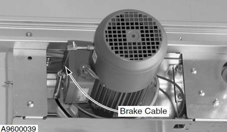 A steel cable links the electrical brake mechanism, located just above the drive motor, to a brake release handle mounted on the drive side column.