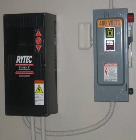 The control panel and disconnect are typically mounted adjacent to the left side column.