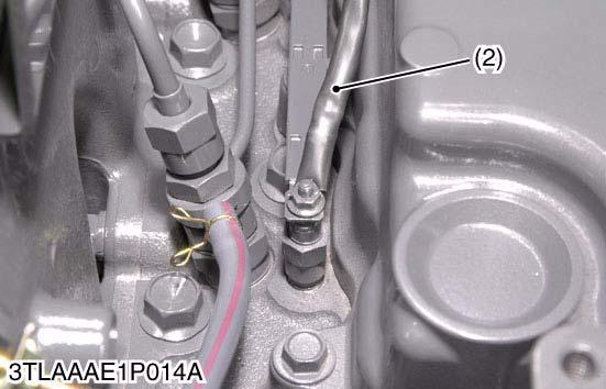 Disconnect glow plug wiring harness (2). 3.