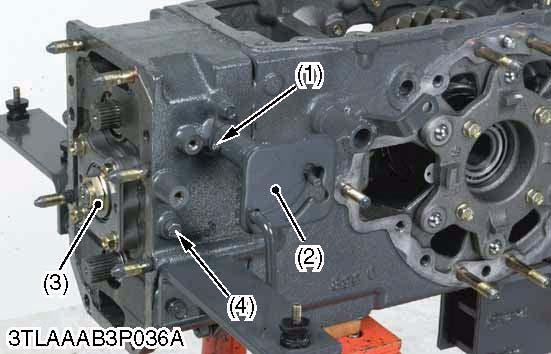 L3200, WSM TRANSMISSION Mid Case 1. Tap out the spring pin (1). 2. Remove the guide plate (2). 3.