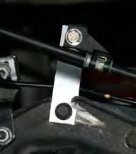 socket. (See Photo # 36) 51. Remove the OEM rear U-bolts using a 1 1/6" socket. Note: The rear axle will now be free to move, so support securely with a floor jack. 52.