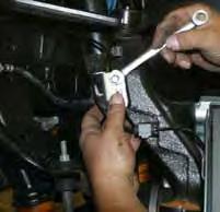 (See Photo # 5) Note: It may be necessary to strike the the OEM steering knuckle to dislodge the OEM tie rod end. Be careful not to damage the OEM tie rod end. 9.