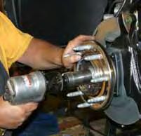 (See Photo # 6) Remove the OEM brake caliper assemblies using a 21mm socket & wire the OEM brake caliper assemblies out of the way so there is no stress on the OEM brake lines.