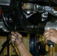 (See Photo #12) Do not remove the OEM drive shaft all together. Simply strap it out of the way.