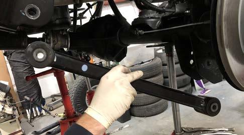 Remove BOTH of the rear lower control arms and save the hardware. 43.