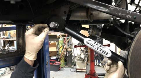 Install the new lower control arms making sure that the grease fitting on the eyelet side will