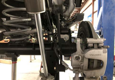 Install new rear shock absorbers using the OE hardware.