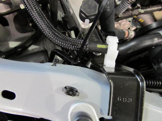 Plug in right DRL into harness plug and secure with wire tie to