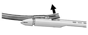 Squeeze the tabs on each side of the wiper blade assembly and slide the assembly off the end of the wiper arm. 3.