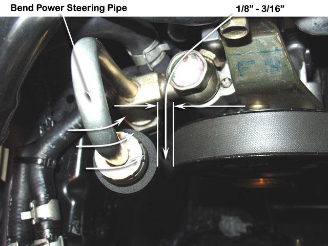 6 Carefully bend the power steering pipe shown towards the power steering pump