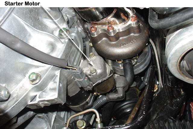14 Install the stock starter motor and retain using