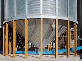 GSI commercial hopper tanks start at the concrete foundation with heavy structural wide-flanged columns, factory welded to thick steel base plates.