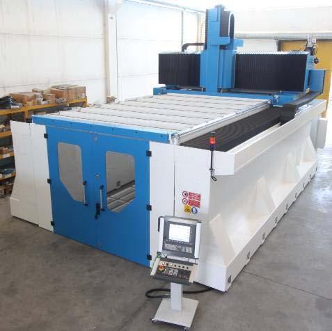 CNC LABORSHAPE Machine overhead covering WAVE SKY is a bellows system that limits the escape of fumes, dust and chips from the workstation area.