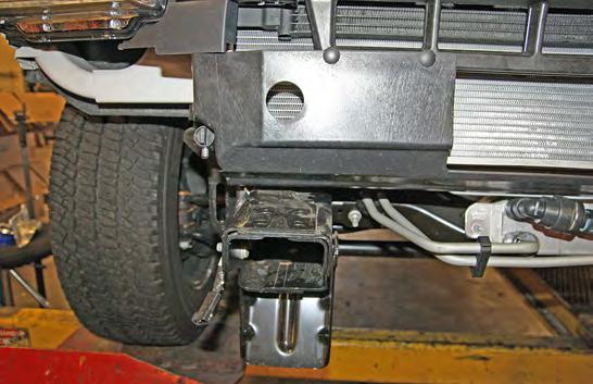 brace, the frame guard, and the frame using the supplied ½" x 2" bolts and ½" flat washers.