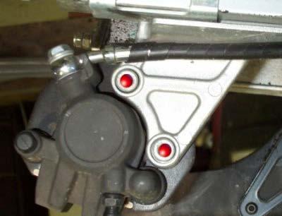 To provide free movement of the caliper, I suggest removing this rear line holder, as shown above.