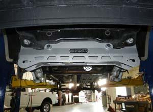 Locate and install front cross member using the factory control arm bolts and