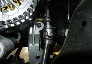 bolts, lining up the steering extension through the 3/4 rod end.