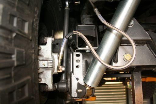 The rear lower shock relocation bracket position can vary depending on the combination of the bump stop spacer height, shock length and control arm length.