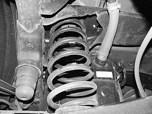 Disconnect the upper control arm from the axle. Retain hardware. (Fig. 8) 32.