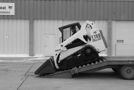 TRANSPORTING THE BOBCAT LOADER Figure 10-40-2 Procedure WARNING Adequately designed ramps of sufficient strength are