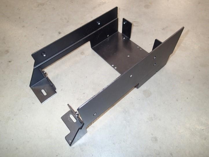 place and bolt front hump bracket to floor with