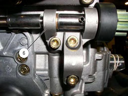 Route cables d and f on outboard side of coolant bottle and under the recoil housing.