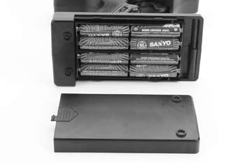 Remove the two body clips from the top of the radio box, and locate the receiver battery box. Install 4 (four) AAA alkaline batteries into the battery holder, noting the proper polarity.