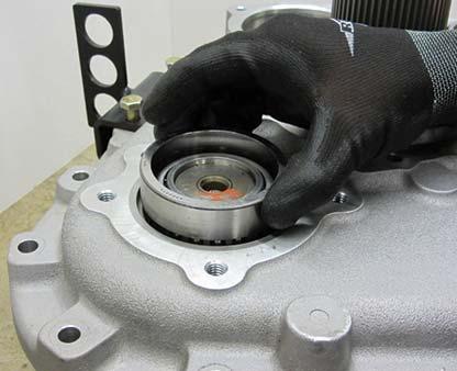 Install the double bearing race into the auxiliary case with the race flange