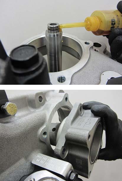 Apply lube to the o-ring on the Range Shift Fork Shaft and Range Cylinder o-ring, install the Range