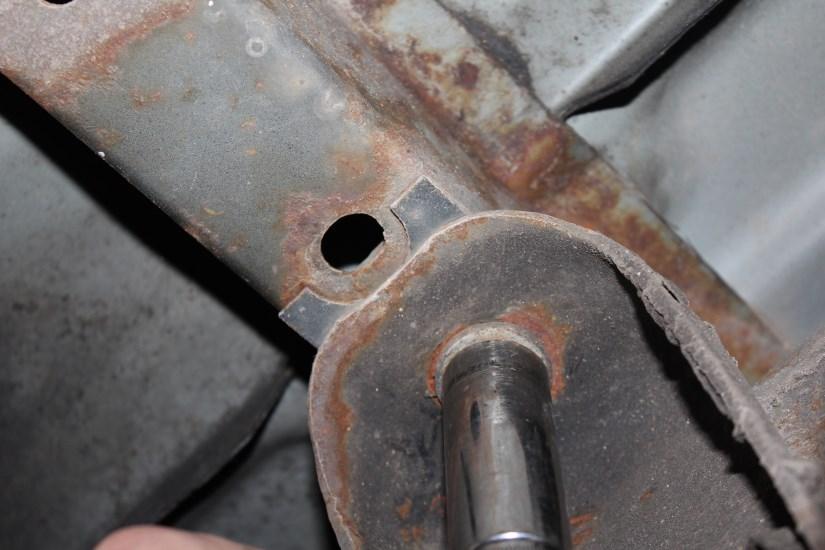 A. Locate bed bolt and remove the bolt.