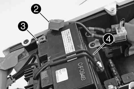 ELECTRICAL SYSTEM 115 Remove positive terminal cover. Disconnect the positive (plus) cable of the battery. Detach rubber band. Pull the battery up and out of the battery rack. 13.