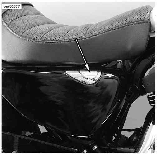 Oil Dipstick Location: Sportster Models Oil Level Cold Check 1. Position motorcycle so that it is leaning on jiffy stand on level ground. 2. Remove filler cap. Wipe attached dipstick clean.