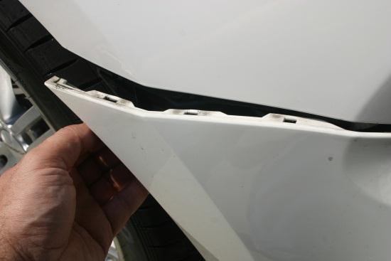 first using a trim removal tool or screwdriver, and then removing the outer portion from the vehicle. d.