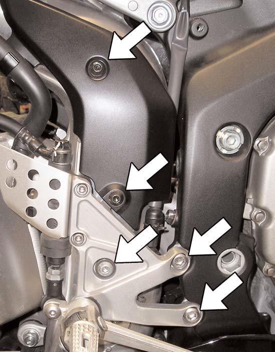 motorcycle. See Figure #9 19)Remove the indicated s-bend mounting bolt.