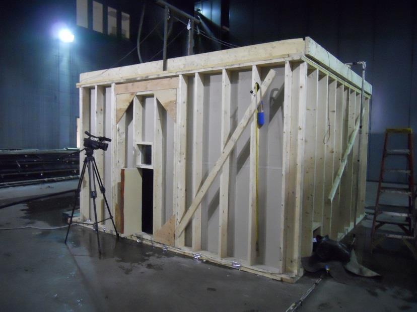½-Scale Test Facility 0.85 m 1.4 m 1.4 x 2.2 m removable panel Window 0.4 x 1 m door 8 ft (2.4 m) 45 O Window 1 m 0.76 m Elevation View Side View 12 ft (3.7 m) 0.45 x 0.91 m ceiling hatches Nozzle 0.